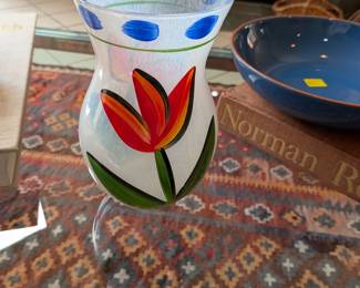 This is a Kosta Boda "Tulipa" vase, hand-painted with a red and yellow tulip motif, designed by Ulrica Hydman-Vallien.