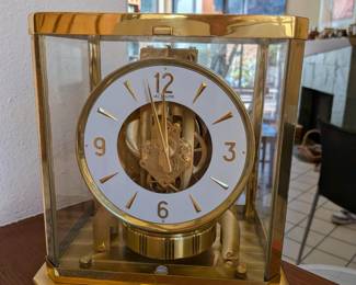 is a Jaeger-LeCoultre Atmos Classique Phases de Lune clock, reference Q5117201. It is a perpetual motion clock that runs on air.  Sells for $1200-14000