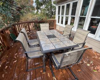 Outdoor ceramic tile top table with six chairs