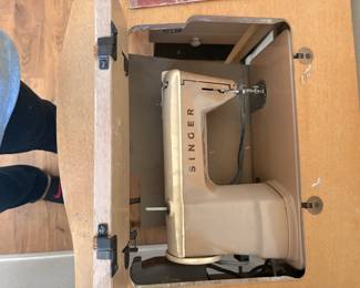 Vintage singer sewing machine in original cabinet
