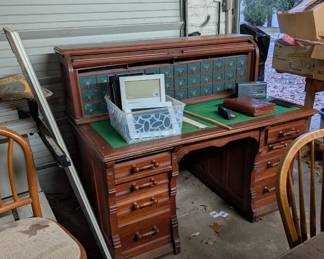 Wonderful old oak desk with cubbies and roll top.
