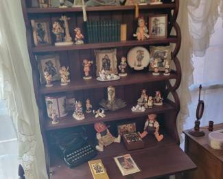 Bookshelf Desk with Lots of Hummel Figurines, Antique Books, and Antique 1917 Corona Folding Typewriter