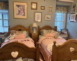 Pine twin beds with heart cutouts