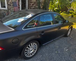 2007 Mercury Montego AWD Premier with flat Black matt exterior, new tranny, Leather interior, WiFi bluetooth upgraded stereo, and 8 bodies can fit in the trunk!!  oh my.  Even an available warranty that got me the new transmission last year! 
