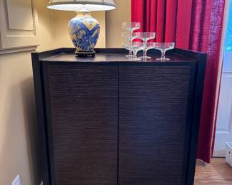($650 wood storage cabinet with inlay 3 x 21 x 42), ($100 Chinoiserie yellow lamp 24”), ($60- set of 6 + 1 MCM champagne flutes)