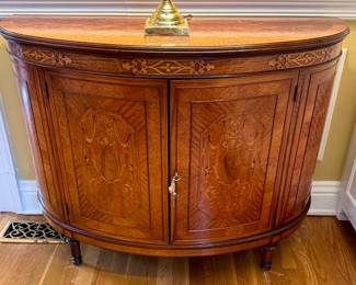 $1,200 - Demilune cabinet, lovely inlay detailing. Door pin need a minor tweak to help keep the door closed - 43x16x33