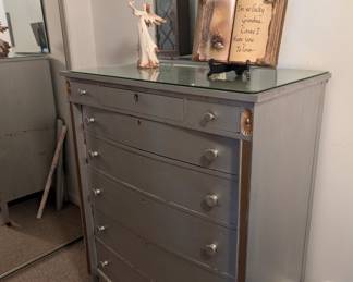 Tall silver glass-top dresser