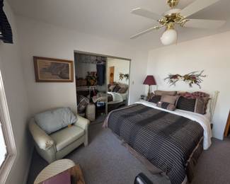 In-law suite bedroom 1 - Queen size bed with white iron headboard. 