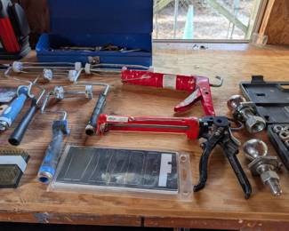 caulk guns, paint rollers