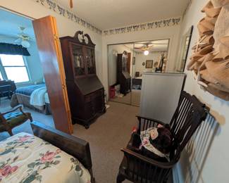 In-law suite bedroom 2 - antique dark-wood secretary, chair, filing cabinet