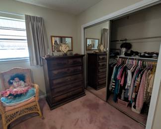 Women's clothing, dark wood tall dresser, cute wicker chair