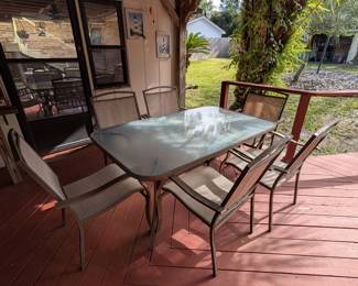 glass-top patio table and chairs 