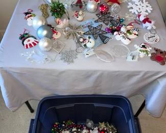 Variety Bin of Christmas Ornaments And Small Table Decorations