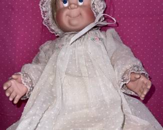 Plastic Baby Doll In Dressing Gown
