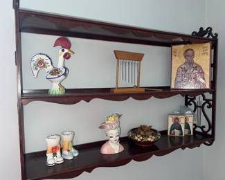 Curio shelf with fun collectibles and Greek Orthodox icons