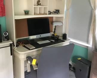 Desk with lots of storage, office chair, Apple computer, etc.