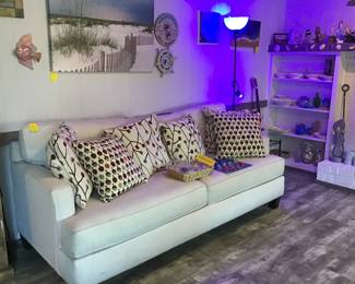 White sofa, art, etc.