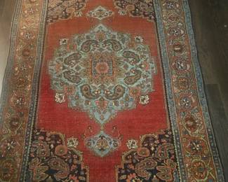 All different sizes and colors of rugs. a few nice Persian rugs
