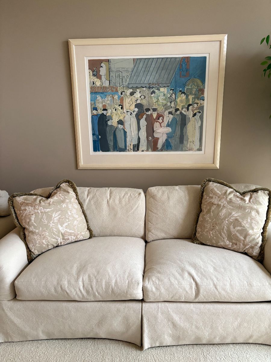 Beautiful Ivory upholstered couch with decorative pillows