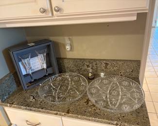 Waterford Crystal Champagne flutes and decorative glass plates. 