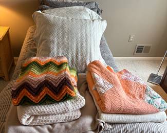 Blankets, pillows, twin size mattress and decorative pillows. 