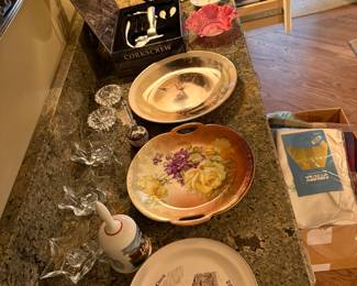 Decorative plates, candlesticks, wine opener and dishes. 