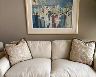 Beautiful Ivory upholstered couch with decorative pillows