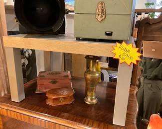 Small grey, participle board side table/platform. $10 + tax.