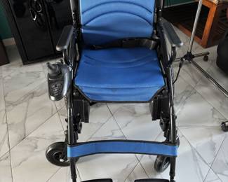 Motorized wheelchair, never used. With manual and charger. 