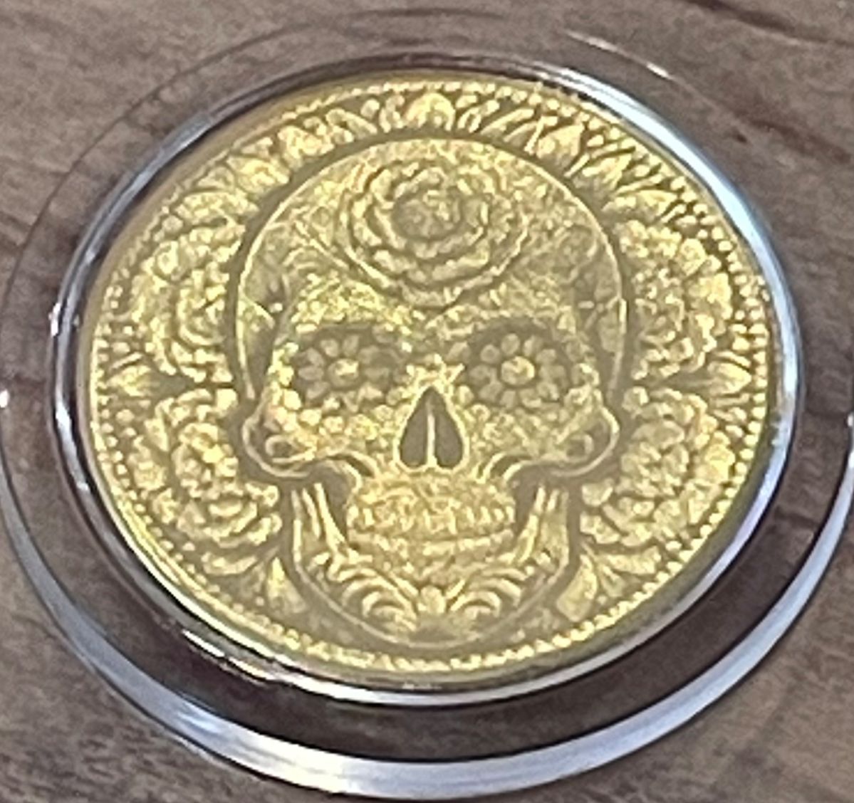 Tiny gold day of the dead coin