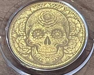 Tiny gold day of the dead coin