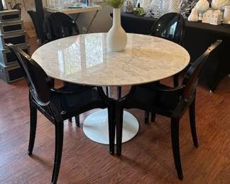 Mid-Century style Tulip Table (solid) and 4 black modern molded acrylic.
