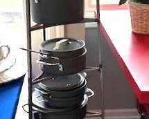 Very cool free-standing 6-Tier Gourmet Cookware Stand and Calphalon sauce pans, pots, double boiler, etc.