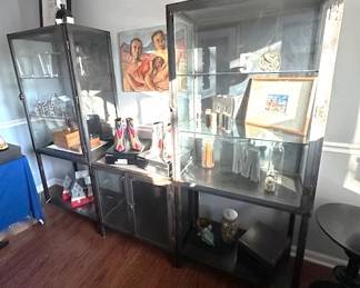 Industrial wrought iron and glass cabinets.