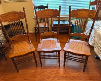 Set of 8 cane bottom chairs used as dining set