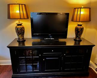 #37 Black Painted Cabinet w/3 door & 1 drawers - 67x20x30 $125.00
#38 Set of 2 Ceramic Black/Gold Floral Base Lamp - 30" Tall $150.00
#39 Vizio 31" TV - Not flatscreen (no remote) $30.00