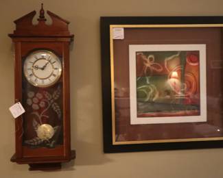 Antique wall clock with one of a pair of contemporary art under glass