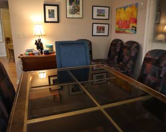 Table in glass, burl, and black detail by MasterCraft