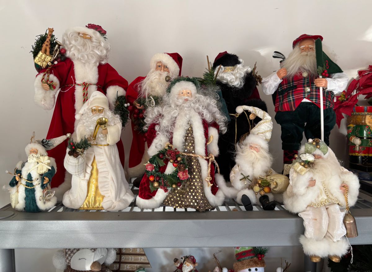 Several Santa Clause’s, figures, and ornaments.