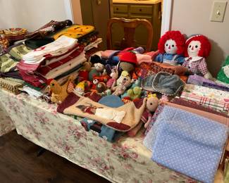 Seasonal table runners, seasonal hand towels, placemats, home made crafts, hats, purses. Lots of fabric and some sewing items. Ask about the sewing machine.