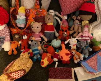 Home handmade items, dolls, animals, fish, several sweet aprons, stockings, baby blankets, wash cloths, purses and pillow.