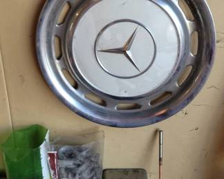Hubcaps - Mercedes, Ford, Chevy throughout the garage