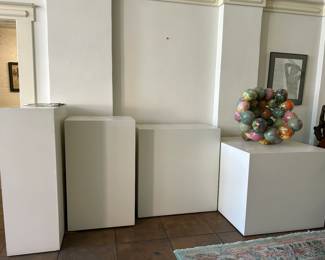 Display pedestals. There are appx 14 in various sizes. Note: the sculpture pictured is not for sale. I couldn't move it.