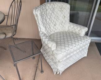 Two white swivel rockers