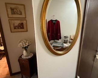 Oval mirror, suitcase stand or drying rack, small cabinet, flower vase