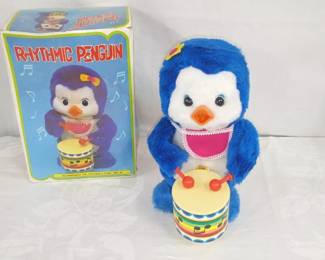 Rhythmic Penguin Playing Drums