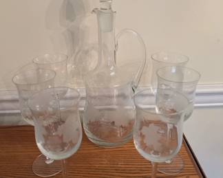 Etched glass decanter set with grapevine design