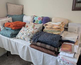 Decorative pillows, bed linens...