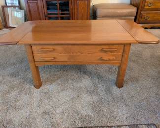 Matching wood coffee table with extensions and drawer