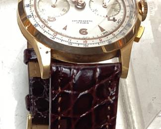 VINTAGE 18KT ROSE GOLD CHRONOGRAPHE SUISSE MENS WATCH, STEM WIND. WATCH is ANTIMAGNETIC, JEWELED WITH 17 RUBIES. WATCH HAS BEEN RECENTLY SERVICED. HAS NEW BURGUNDY ALLIGATOR LEATHER BAND. CASE IS STAMPED 18KT 750 with 100. THERE IS A SMALL SCRATCH ON THE CRYSTAL. WATCH IS IN GOOD WORKING CONDITION.